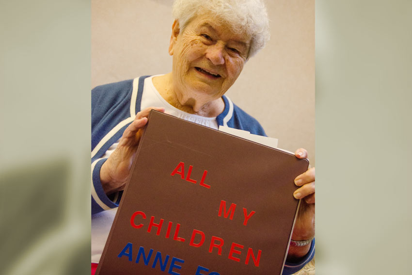 Kelin, 17, holds one of One World Play Project's unpoppable soccer balls.