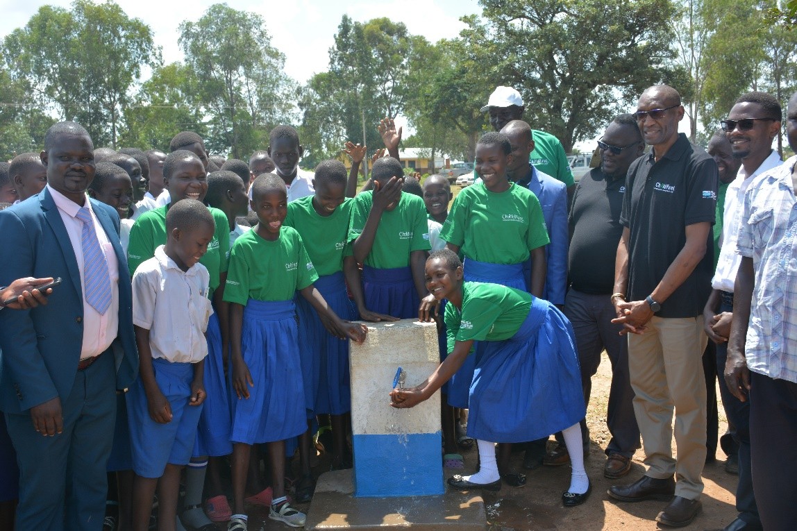 Children celebrate the unveiling of a new borehole built by ChildFund.