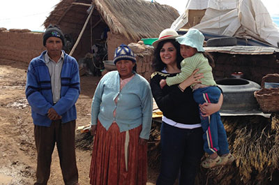 Caroline, of France, meets her sponsored child Mar&iacute;a and her family at Mar&iacute;a's home in La Paz, Bolivia. 